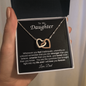 Interlocking Heart Necklace on Black Background (Yellow and White Gold Variant)