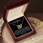 Interlocking Heart Necklace on Black Background (Yellow and White Gold Variant)