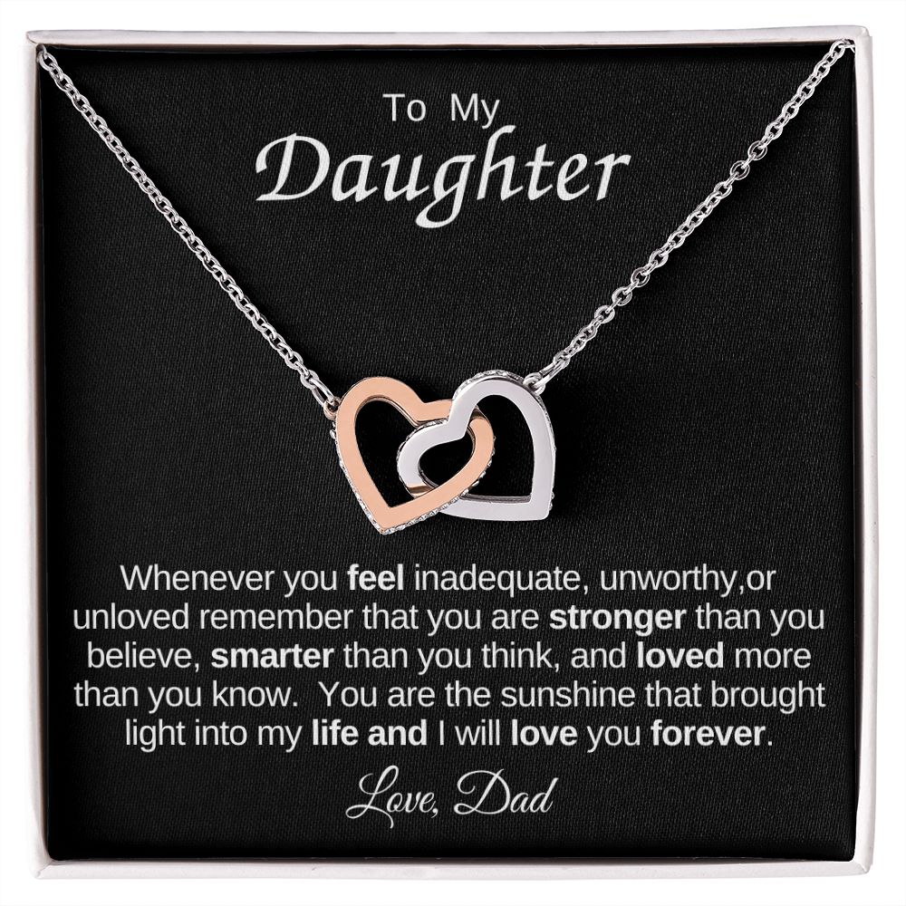 Interlocking Heart Necklace on Black Background (Yellow and White Gold Variant)