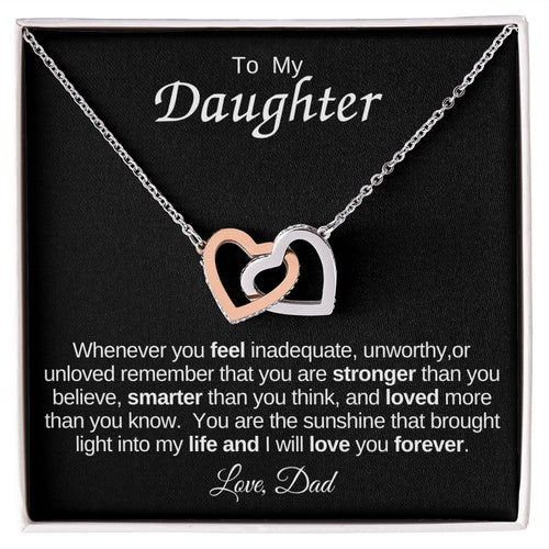 Interlocking Heart Necklace on Black Background (Yellow and White Gold Variant)